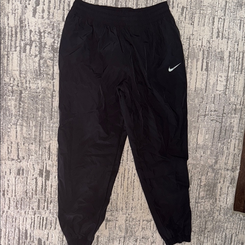 Nike Black Track Tech Pants XL elastic cuffs about 30 inseam. Worn once